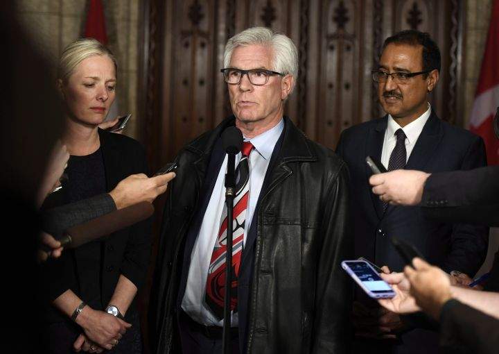 Minister of Natural Resources Jim Carr speaks to reporters with Minister of Environment and Climate Change Catherine McKenna and Minister of Infrastructure and Communities Amarjeet Sohi, after an emergency cabinet meeting on Parliament Hill in Ottawa on Tuesday, April 10, 2018. 