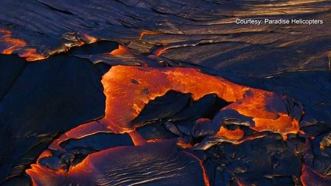 Lava flows across land following an eruption of Hawaii’s