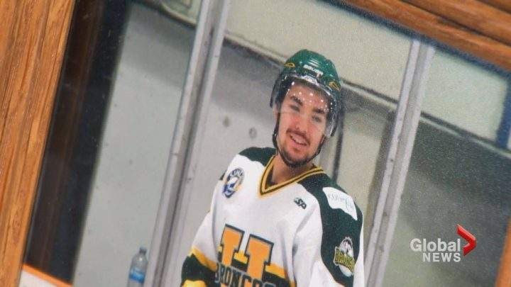 Logan Boulet is seen in his Humbold Broncos hockey gear in a photograph in his family home. 