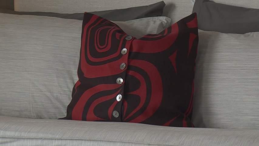A pillow with a First Nation design.