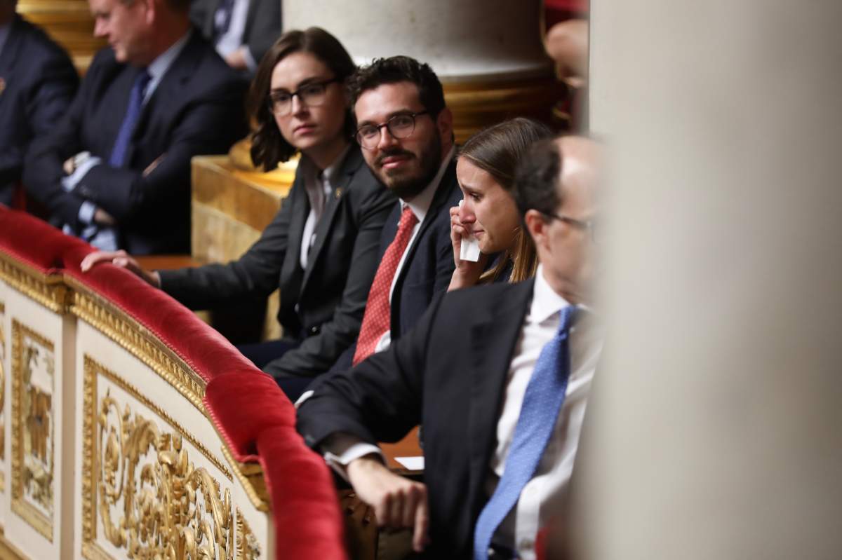 Prime Minister Justin Trudeau’s speechwriter Gabrielle Cesvet is overcome with emotion as she watches the prime minister deliver a historic speech to the French National Assembly on April 17, 2018.
