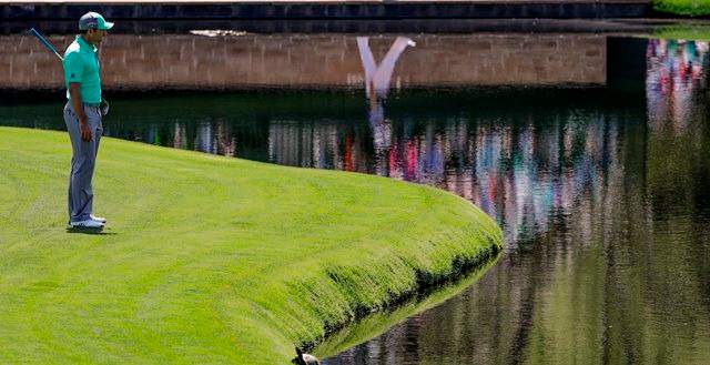 Sergio Garcia, of Spain, looks over the water on the 15th hole during the first round at the Masters golf tournament Thursday, April 5, 2018, in Augusta, Ga. Garcia shot an 8-over 13 on the hole.