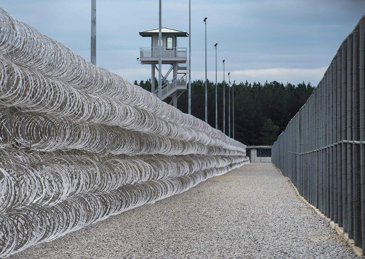 In this Feb. 9, 2016, file photo, razor wire protects a perimeter of the Lee Correctional Institution in Bishopville, S.C.