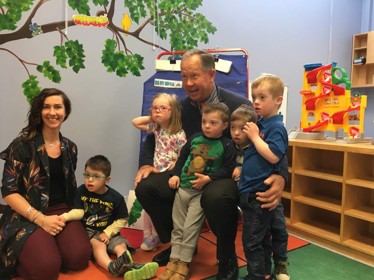 PGA Tour Champions golfer Rod Spittle reading to kindergarten students at PREP school in Calgary on April 26, 2018.