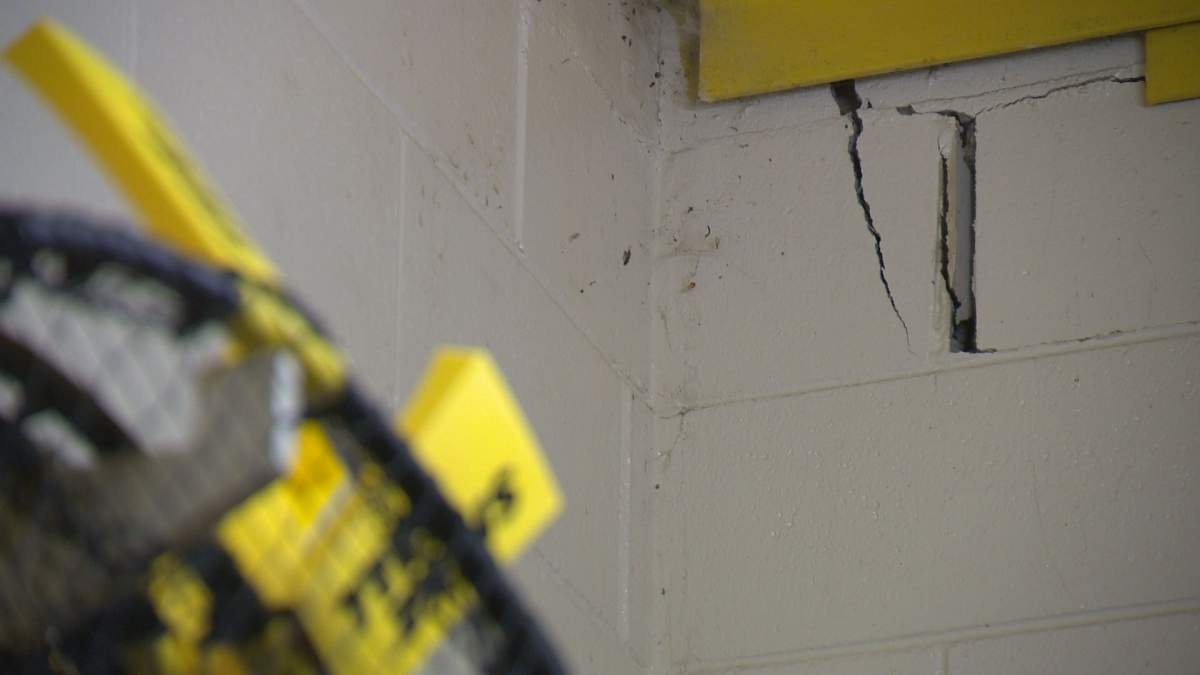 Significant cracks in the bricks inside Ecole St. Pius' gymnasium equipment room.