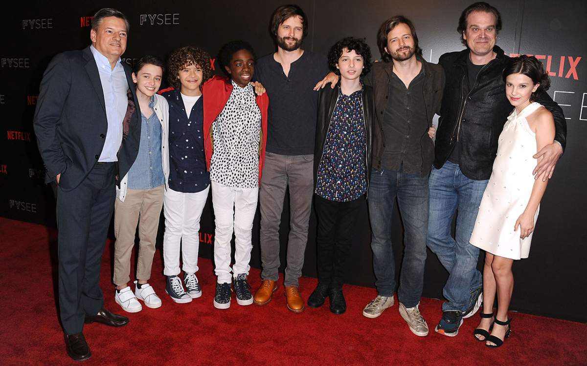 (L-R) Netflix CCO Ted Sarandos, Noah Schnapp, Gaten Matarazzo, Caleb McLaughlin, writer/producer Matt Duffer, Finn Wolfhard, writer/producer Ross Duffer, David Harbour, and Millie Bobby Brown attend the 'Stranger Things' FYC event at Netflix FYSee Space on June 6, 2017 in Beverly Hills, California. 