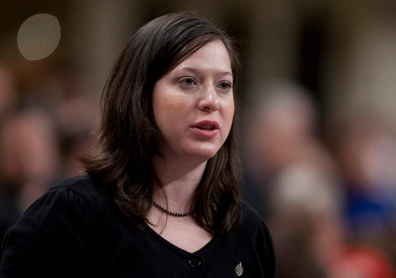 NDP MP Christine Moore rises during Question Period in the House of Commons in early 2012. 
