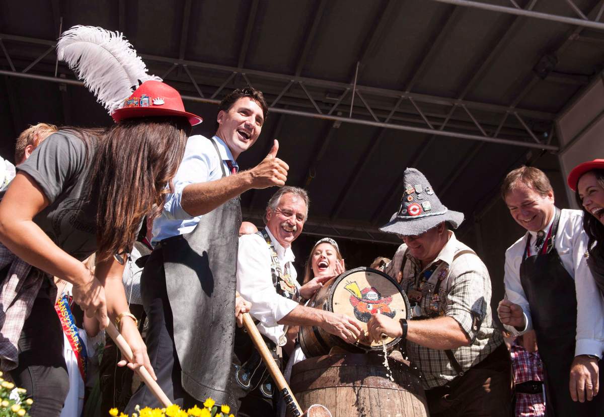 File photo - Prime Minister Justin Trudeau celebrates after tapping the keg at the opening ceremonies for Oktoberfest in Kitchener, Ont., on Friday, Oct. 7, 2016. 