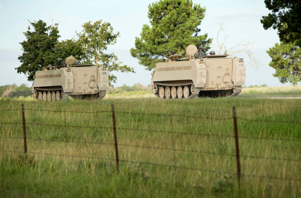 A convoy of National Guard troops moves on Camp Swift, which is also hosting the Operation Jade Helm 15 military exercise, in Bastrop, Texas, on Wednesday July 15, 2015.  