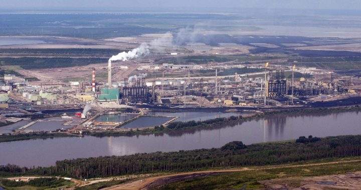 The Suncor mine facility along the Athabasca river as seen from a helicopter.