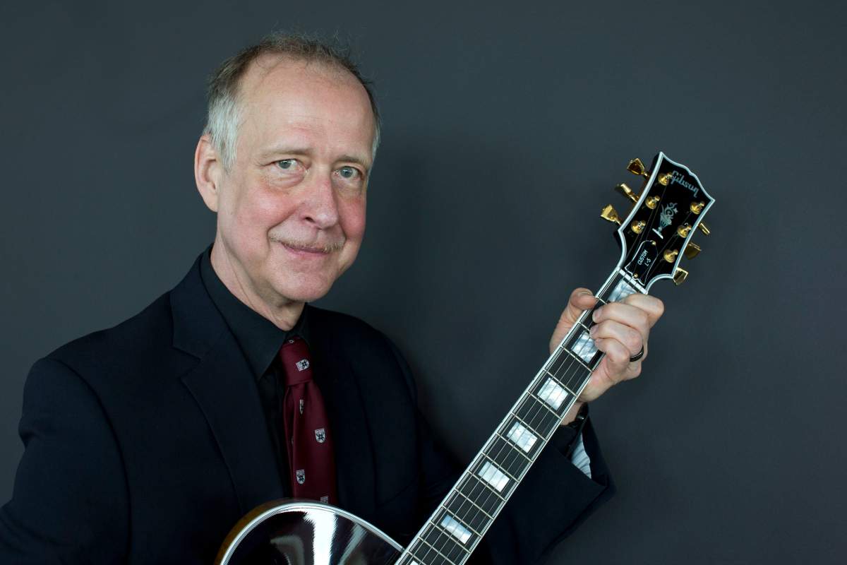 In this June 17, 2016, file photo, Henry Juszkiewicz, CEO of Gibson Brands, poses for a portrait with a Gibson Custom L-5 guitar during the official opening of the European hub of Gibson Brands at the A'dam Tower in Amsterdam, Netherlands. 