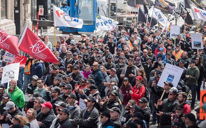 Crane operators participate in a demonstration in Montreal, Saturday, May 5, 2018. Graham Hughes/The Canadian Press.