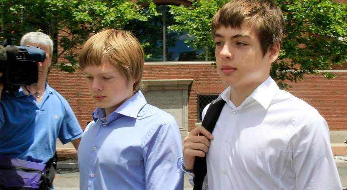 FILE - In this July 1, 2010, file photo, Alex Vavilov, right, and his older brother brother Tim leave a federal court after a bail hearing for their parents Donald Heathfield and Tracey Ann Foley, in Boston, Massachusetts. The now 23-year-old Alex and brother Tim seek the right to reside permanently in Canada, the country where their parents once lived clandestine lives as deeply embedded Russian spies. 