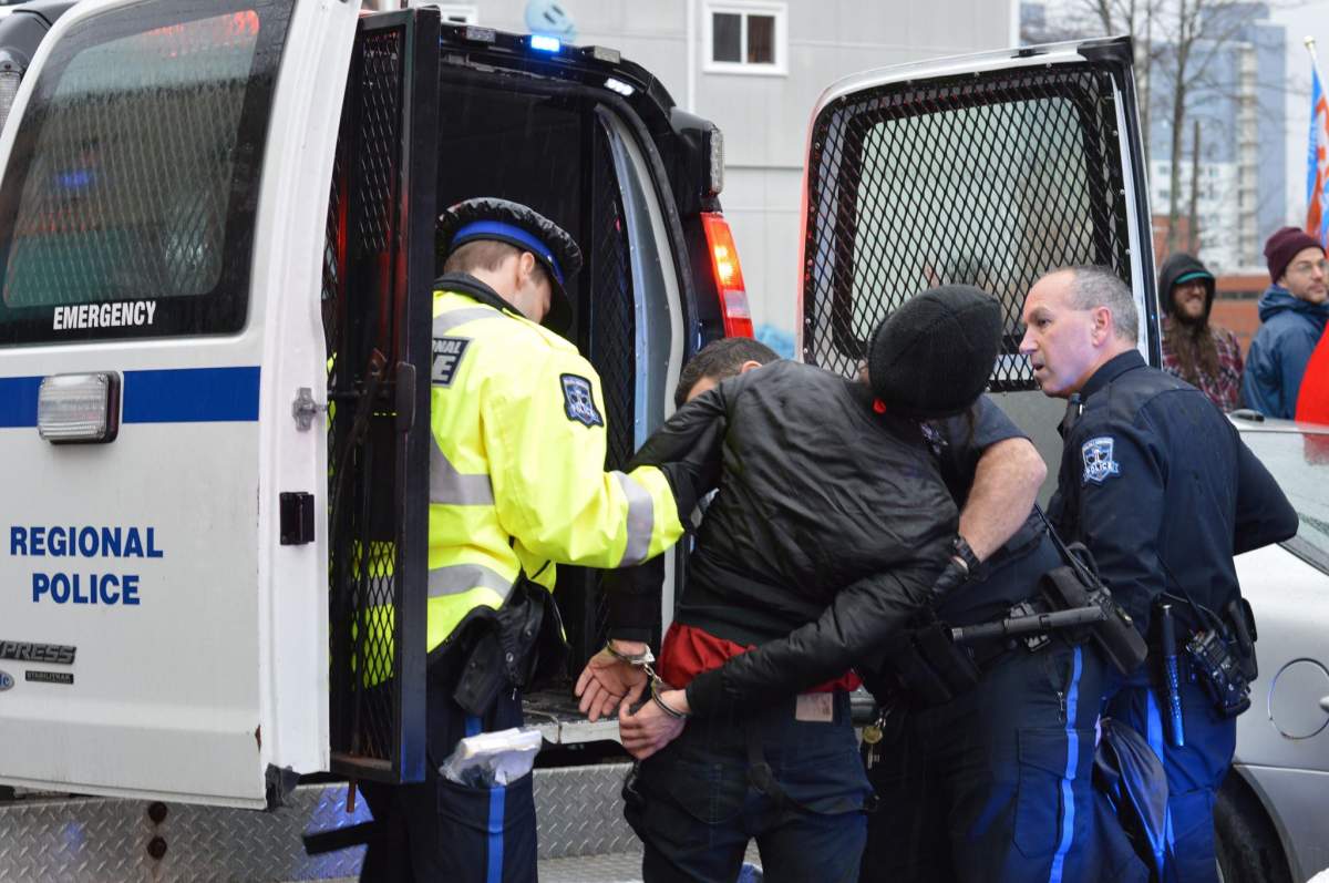 Two people taking part in a May Day rally in Halifax were arrested for breach of the peace on Tuesday evening and later released.