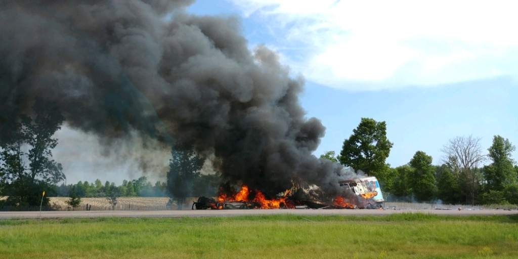 A fire blazes near Napanee on Hwy. 401 after a fatal accident on Wednesday.
