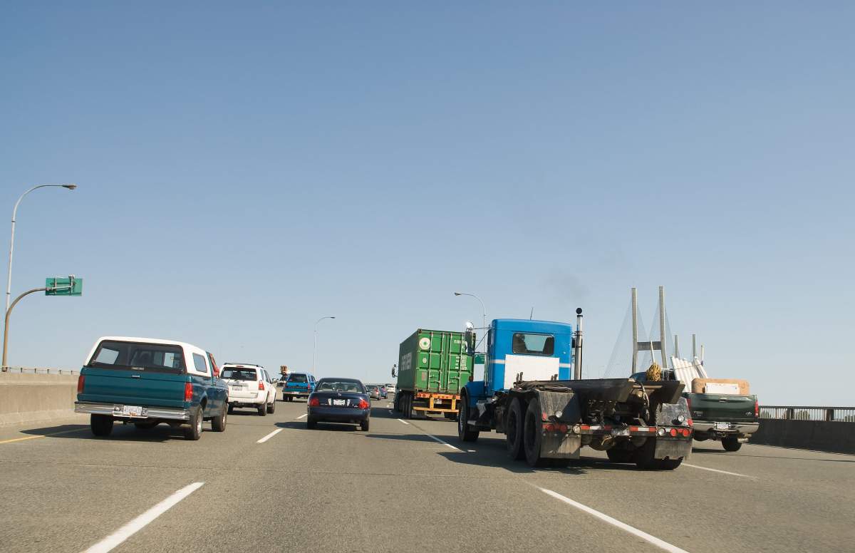 A car drivers view of  traffic on Highway 91 at the Alex Fraser Bridge. The bridge spans the Fraser River between Richmond and Delta, BC in the greater Vancouver area.