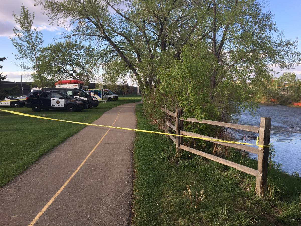 Emergency crews on the scene of a body found in the Elbow River in Calgary on Friday, May 18.