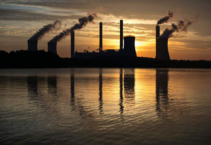  In this June 3, 2017, file photo, a coal-fired plant stands in the distance in Juliette, Ga. 