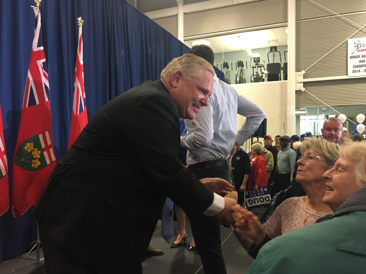 Ontario Progressive Conservative Leader Doug Ford speaks with supporters after a rally in Barrie on Friday night.