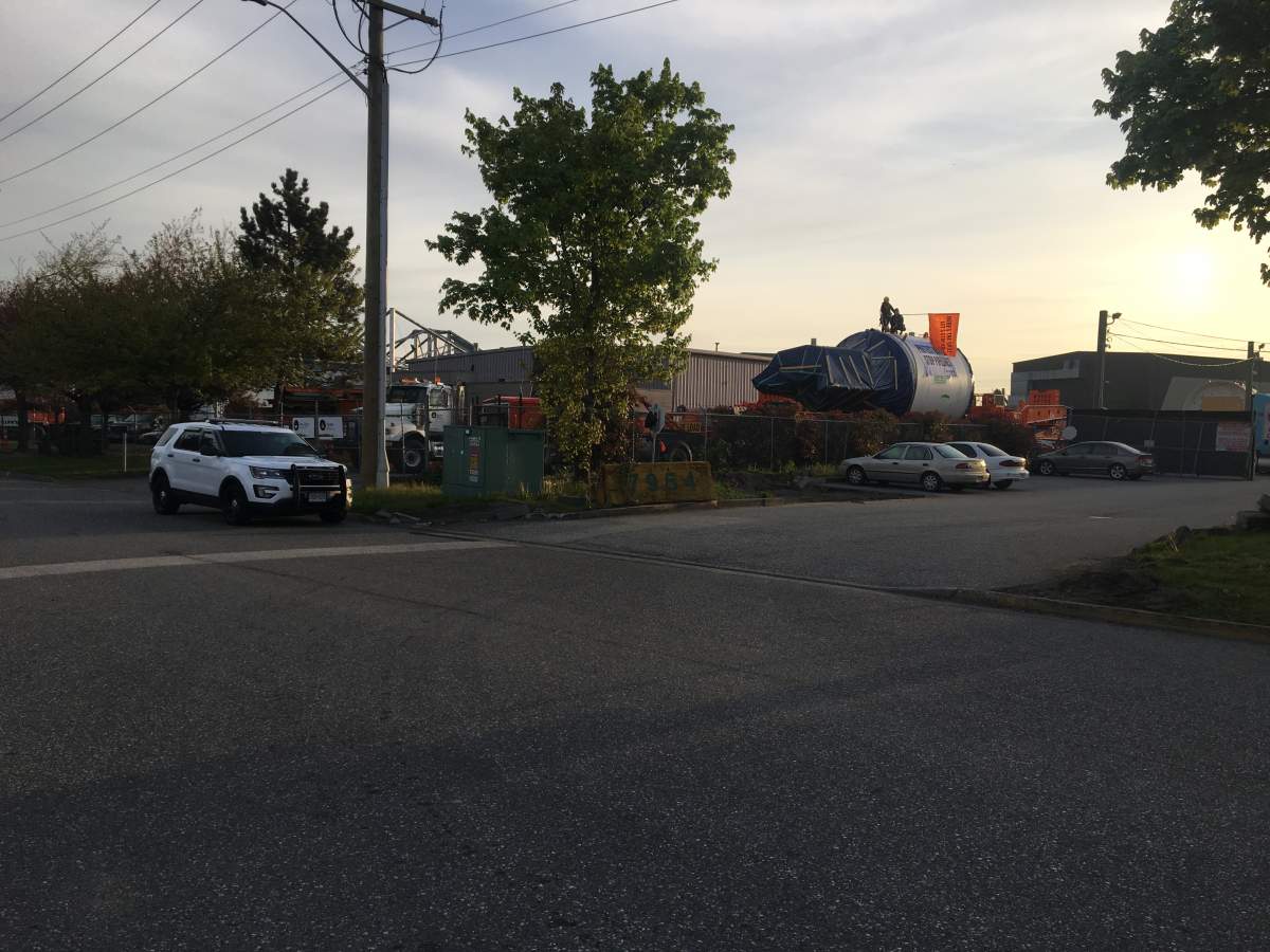 Protesters occupy a piece of Kinder Morgan equipment Thursday morning. Credit: Mike Suzuki / Global News.