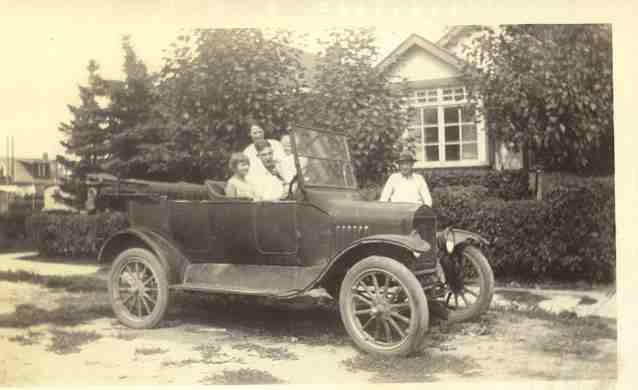 The Cook family in front of their home at 524 8 Avenue N.E.