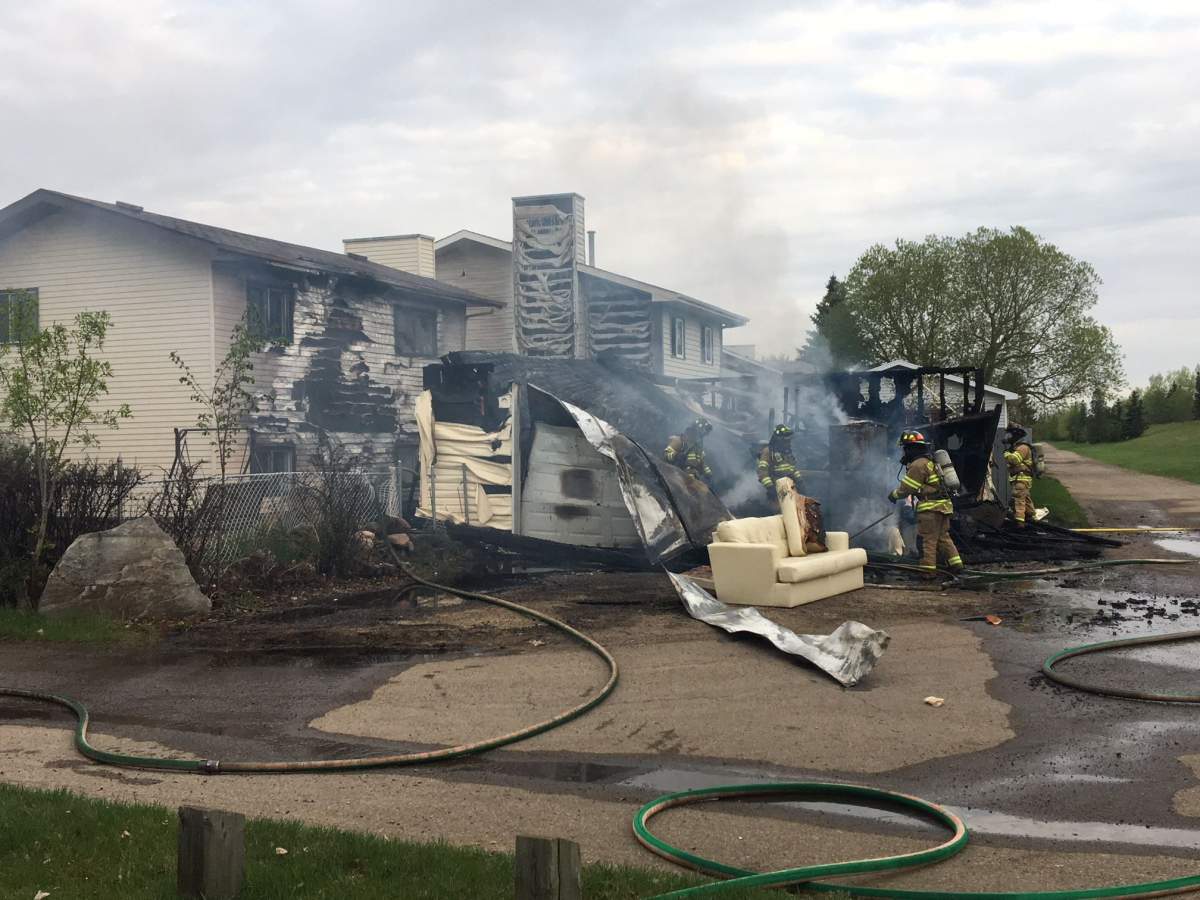 Edmonton firefighters battle a fire in the northeast end of the city, Wed. May 16, 2018. 
