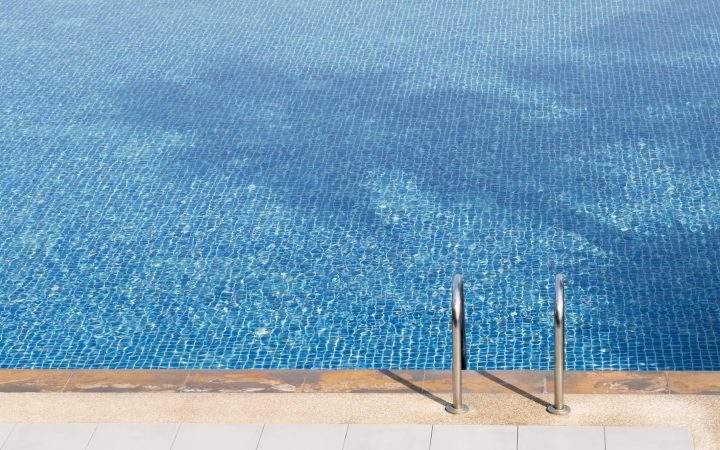 The edge of a swimming pool.