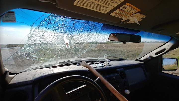 A driver on Highway 16 near Plunkett, Sask., was injured after an axe came through his windshield.