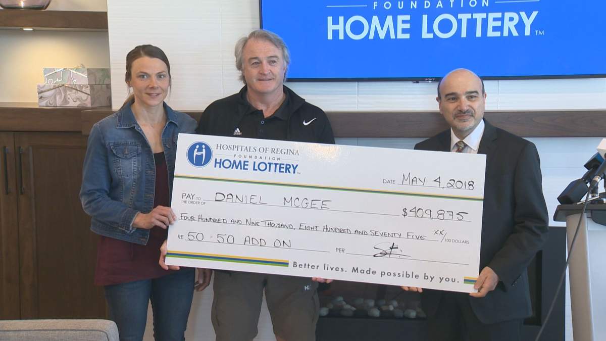 Daniel McGee receives a giant cheque from the Hospital’s of Regina Foundation 50/50 draw.