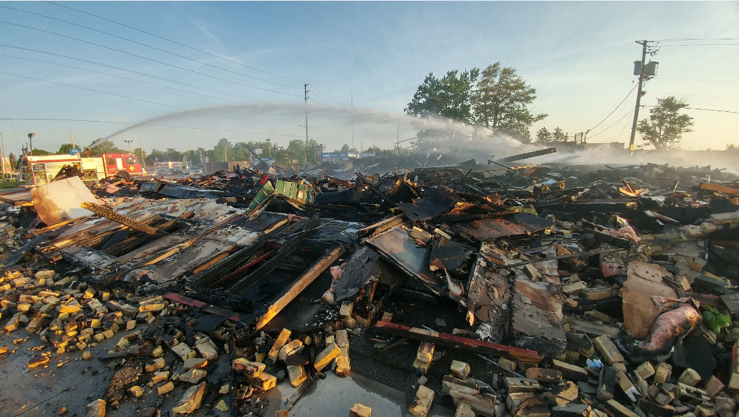 Fire crews work to put out hot spots at the former Hook's restaurant on Southdale Rd. Crews have been battling the blaze since 5:30 p.m. Tuesday.