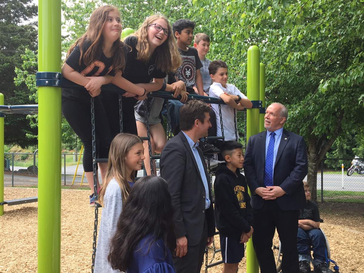 B.C. Premier John Horgan speaks to elementary school students in Langford, B.C. on May 18, 2018. 
