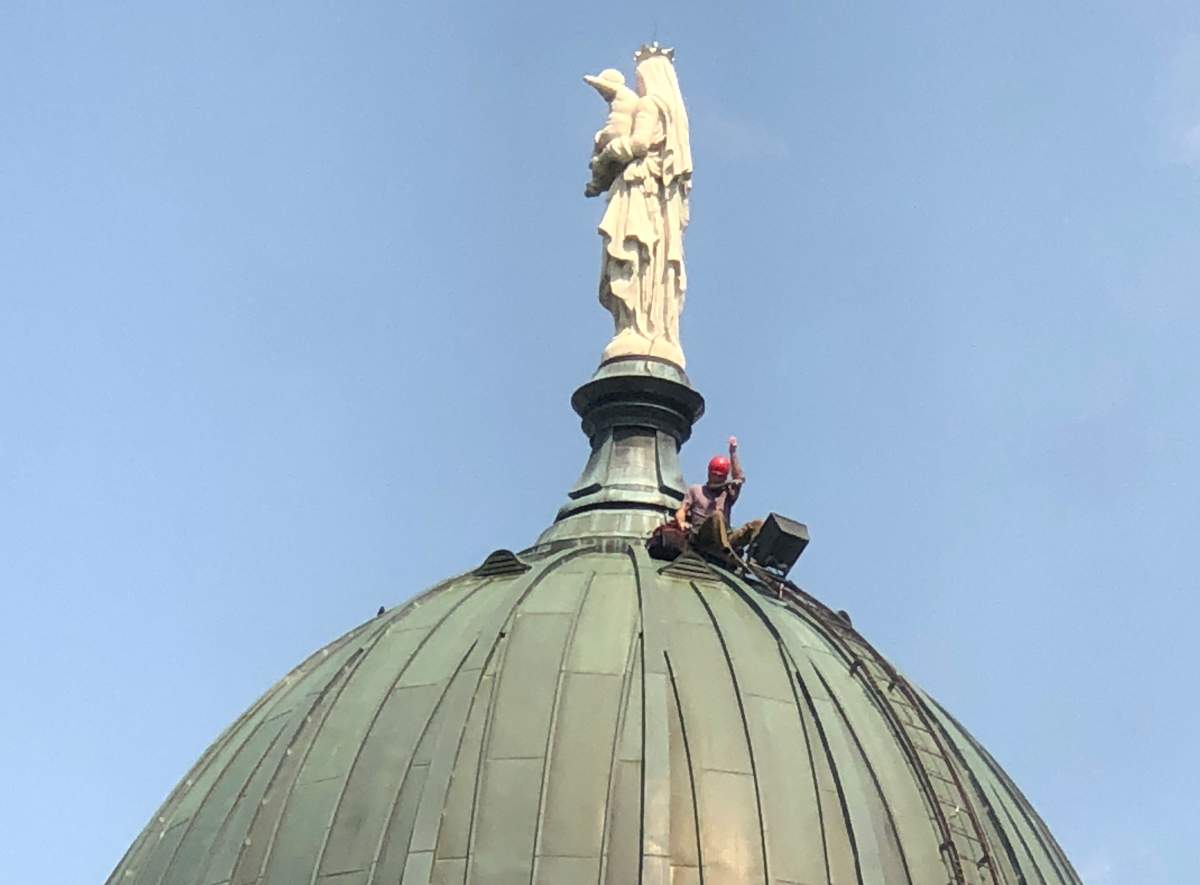 P.E. teacher Mark Abbott sits on top of the dome at Dawson College.