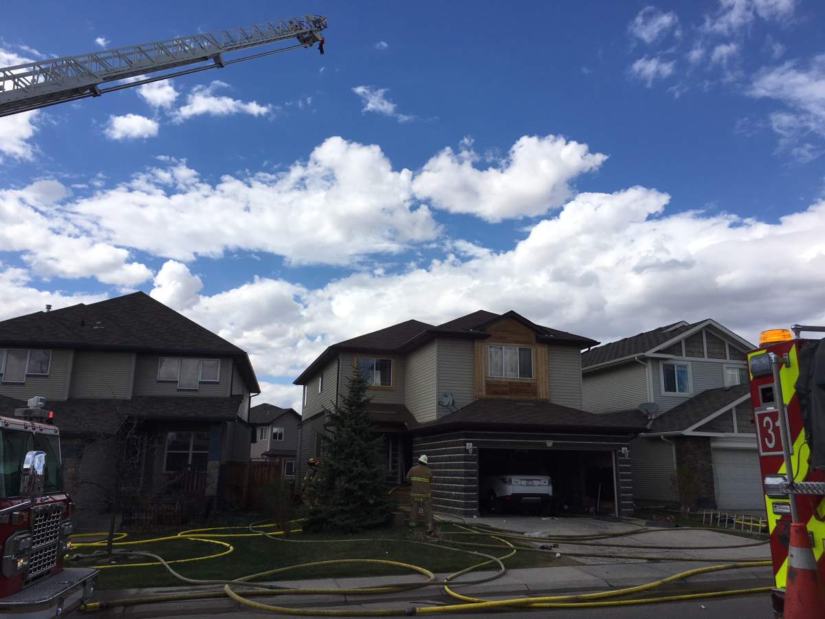 Calgary fire crews on the scene of a house fire in the community of Evanston.