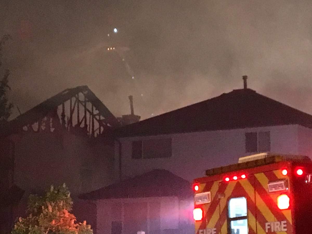 Two homes on Melrose Crescent in the southwest Edmonton neighbourhood of MacEwan were heavily damaged by fire early Wednesday morning. May 30, 2018.