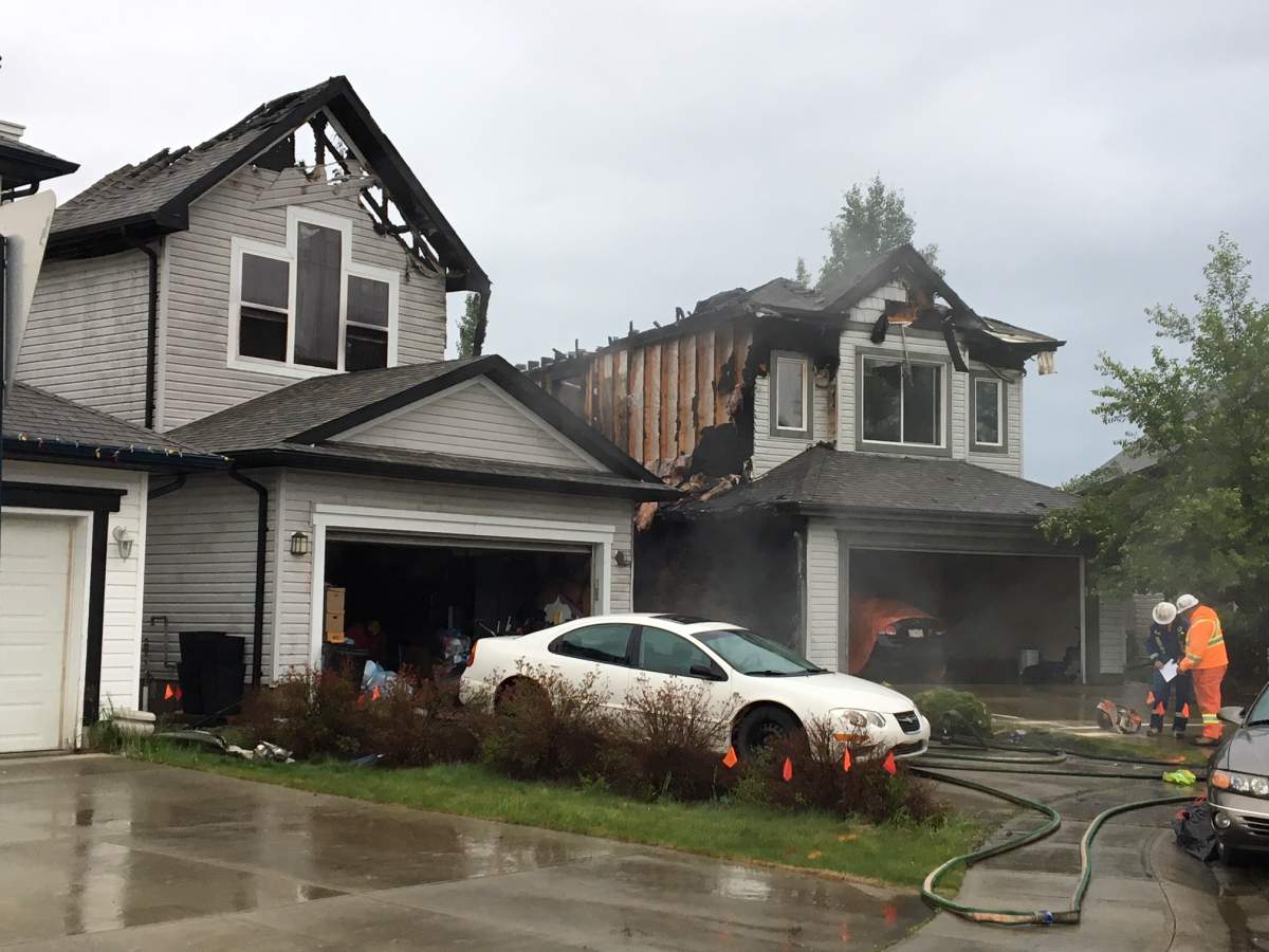 Two homes on Melrose Crescent in the southwest Edmonton neighbourhood of MacEwan were heavily damaged by fire early Wednesday morning. May 30, 2018.