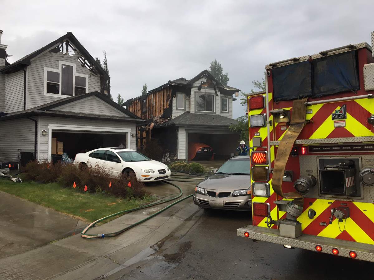 Two homes on Melrose Crescent in the southwest Edmonton neighbourhood of MacEwan were heavily damaged by fire early Wednesday morning. May 30, 2018.
