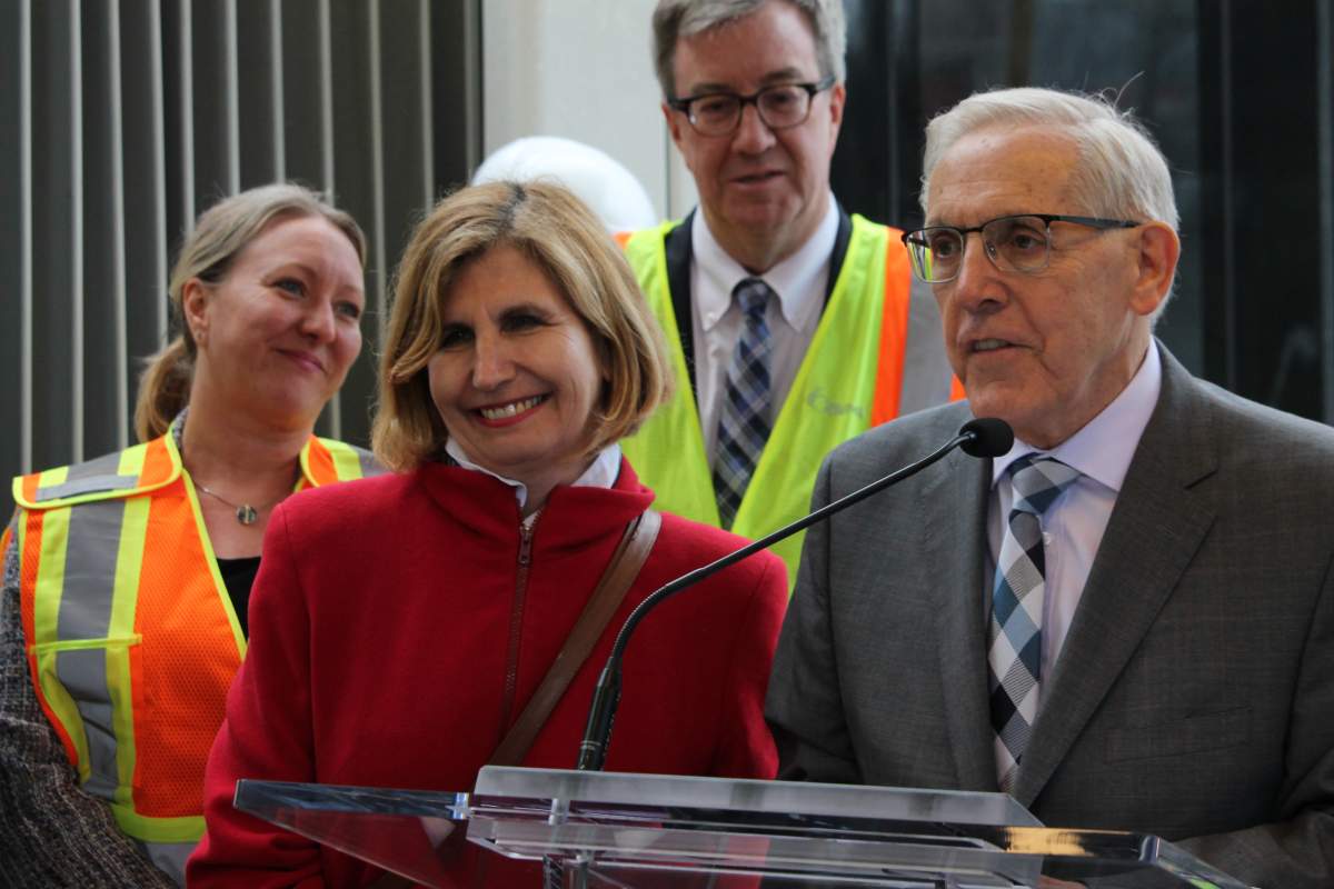 MPP and former mayor Bob Chiarelli speaks alongside MPP Nathalie Des Rosiers, MP Mona Fortier and Mayor Jim Watson at the LRT event on Friday.