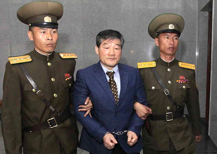 In this April 29, 2016 file photo, Kim Dong Chul is escorted to his trial in Pyongyang, North Korea.