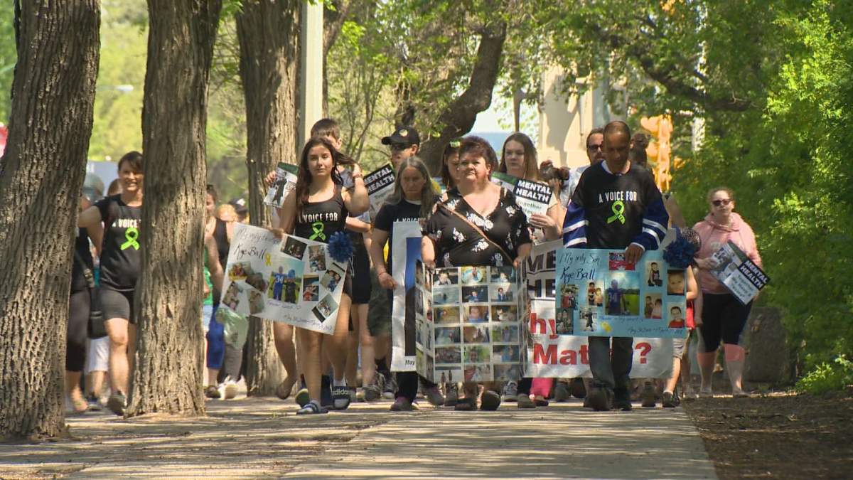 Kadince, Wanda and Chris Ball lead more than 200 calling for improved mental health care access in memory of Kye Ball. 