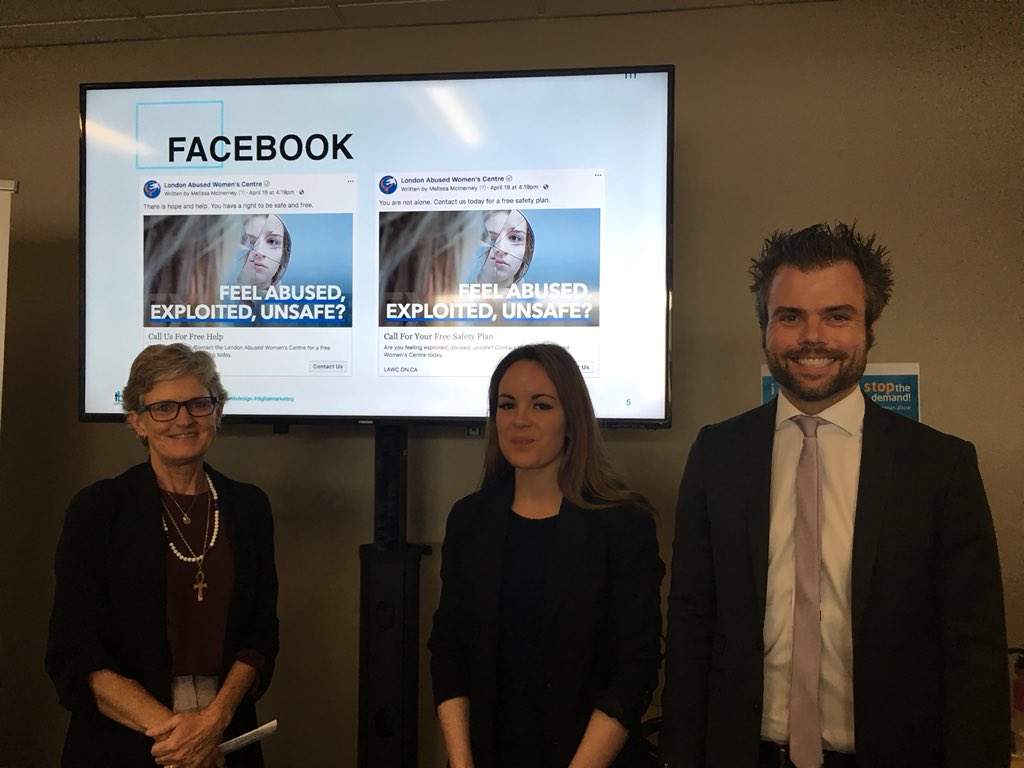 Megan Walker, Executive Director of LAWC, Kylie McConnell, director of accounts at tbk Creative, and Andrew Schiestel, president of tbk Creative, stand in front of some of the ads women might see on Facebook. 