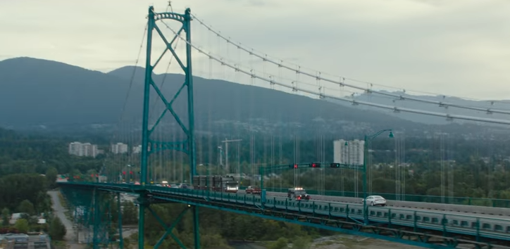 An armoured vehicle travels over the Lions Gate Bridge in Deadpool 2.