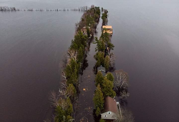 Homes and cottages are seen on Grand Lake, N.B. as floodwaters continue to rise from the Saint John River on Tuesday, May 1, 2018.