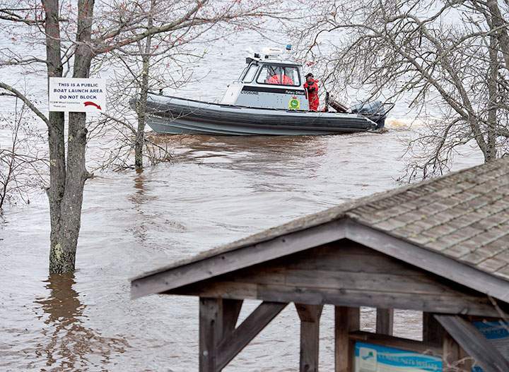 A federal fisheries patrol boat cruises the waters of the Saint John River in Grand Lake, N.B. on Thursday, May 3, 2018.