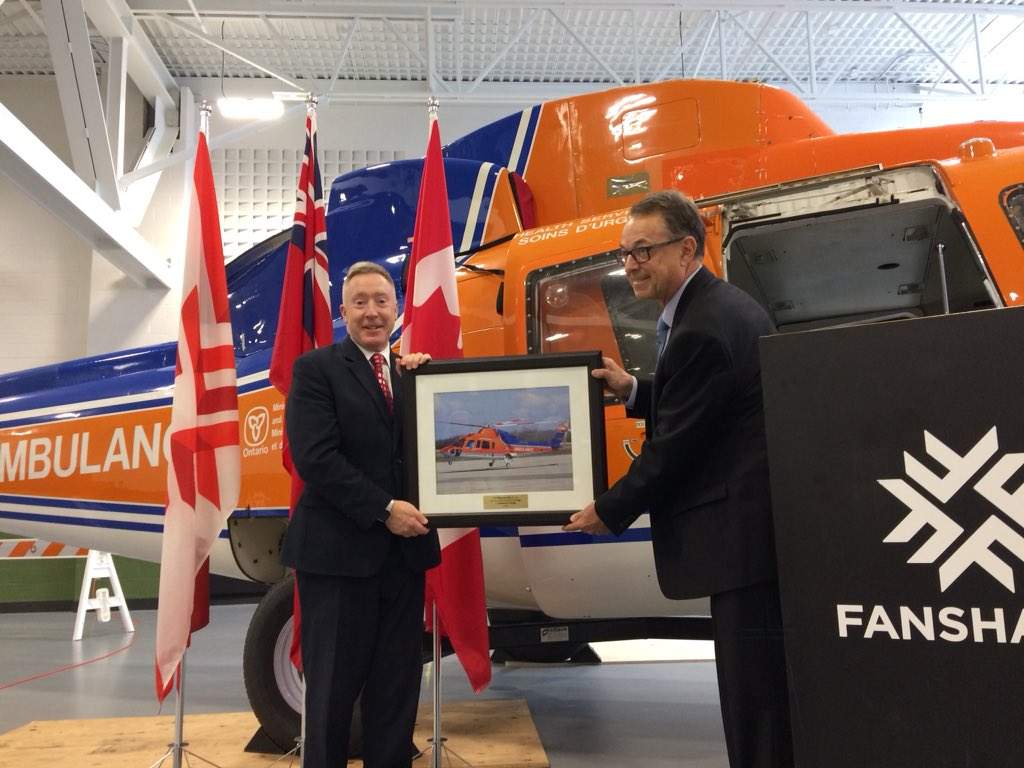 Rob Giguere, Ornge's COO and deputy CEO, presents Fanshawe College president Peter Devlin with a photo of the S-76A in action, during Thursday's announcement. 
