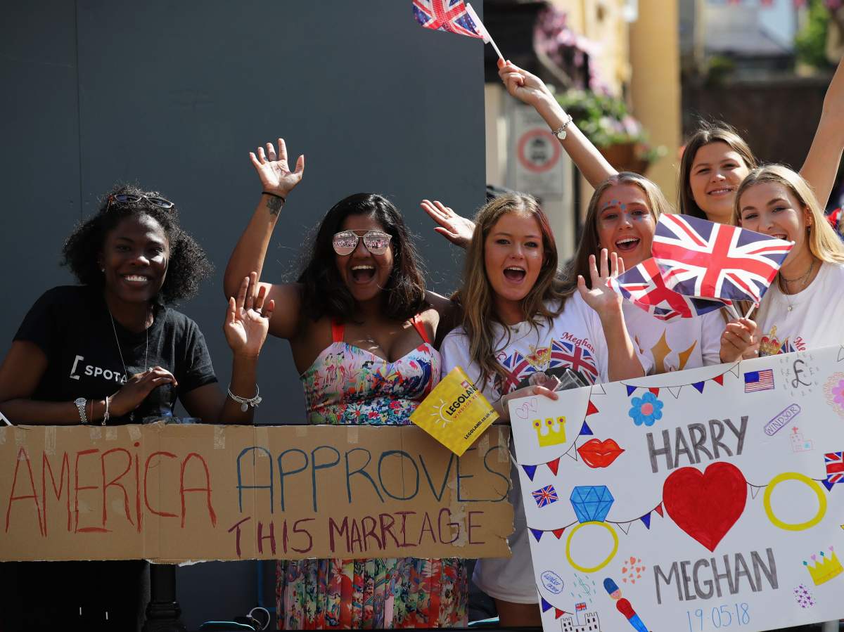 Royal wedding watchers: The crowds come out in full regalia for Prince Harry and Meghan Markle - image