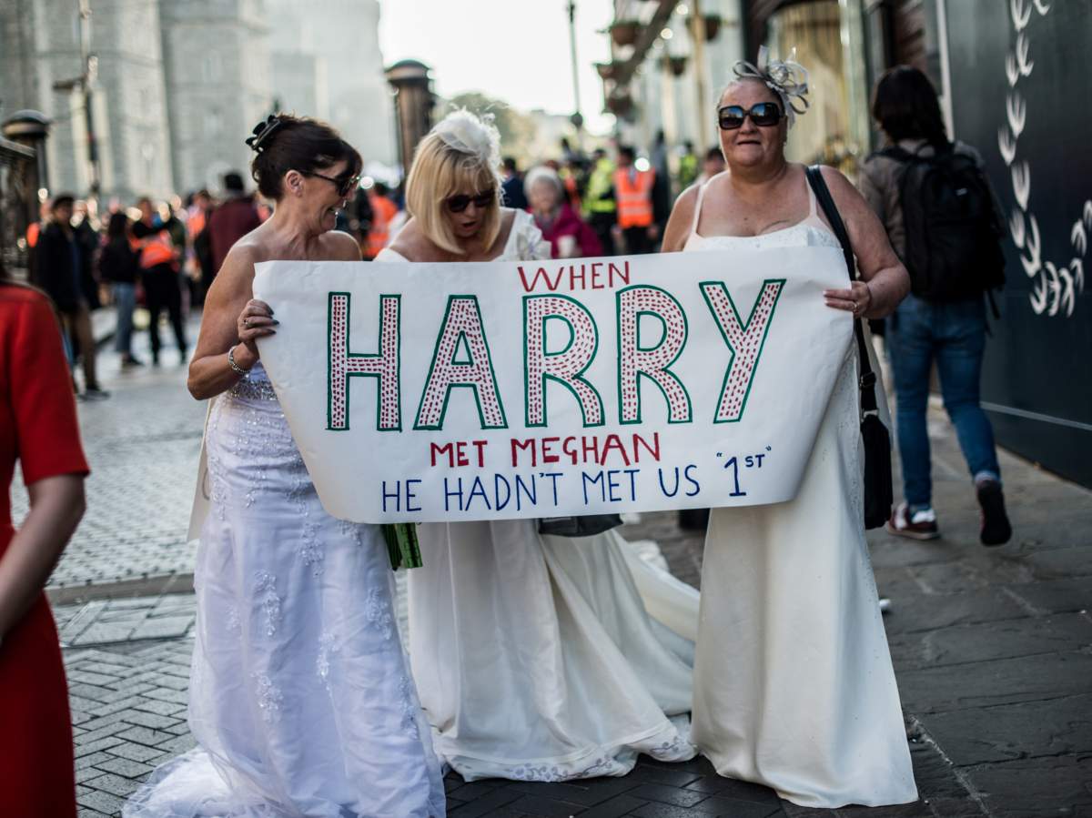 Royal wedding watchers: The crowds come out in full regalia for Prince Harry and Meghan Markle - image