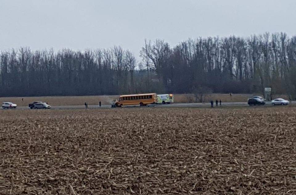 A school bus sits crashed into a car on Highbury Avenue near Ferguson Line.