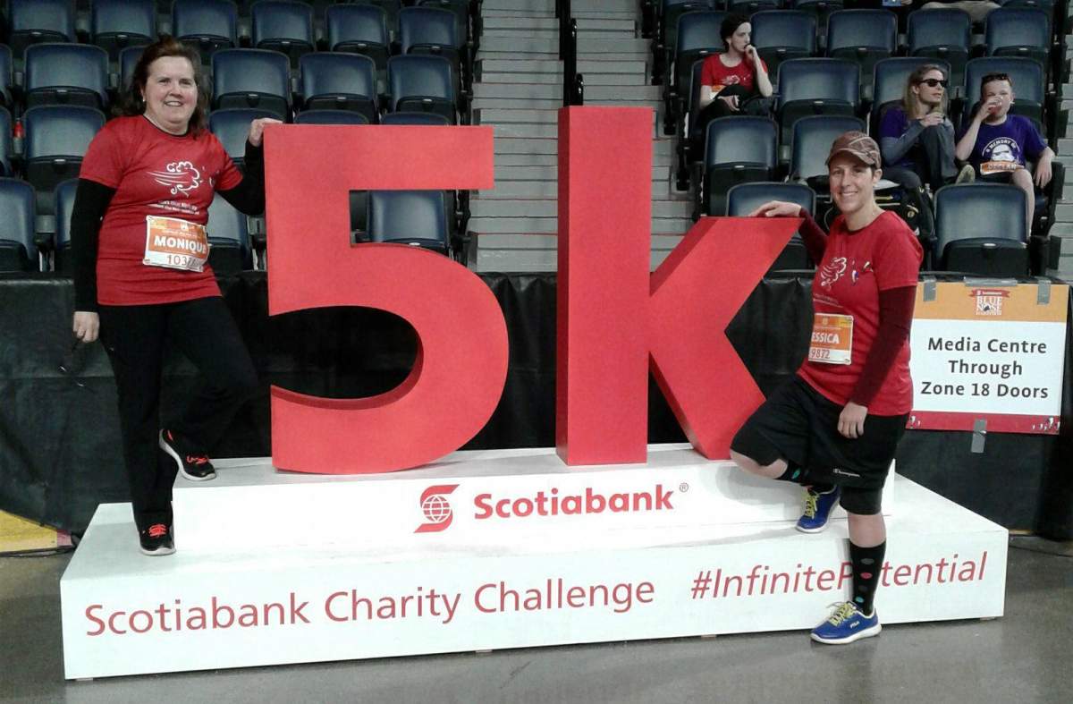 Monique Pelletier and Jessica LeBlanc pose after completing the five kilometre run in the Blue Nose Marathon.