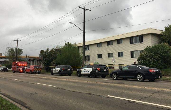 Edmonton police are seen at the scene of a suspicious fire in the area of 80 Street and 117 Avenue on May 30, 2018.