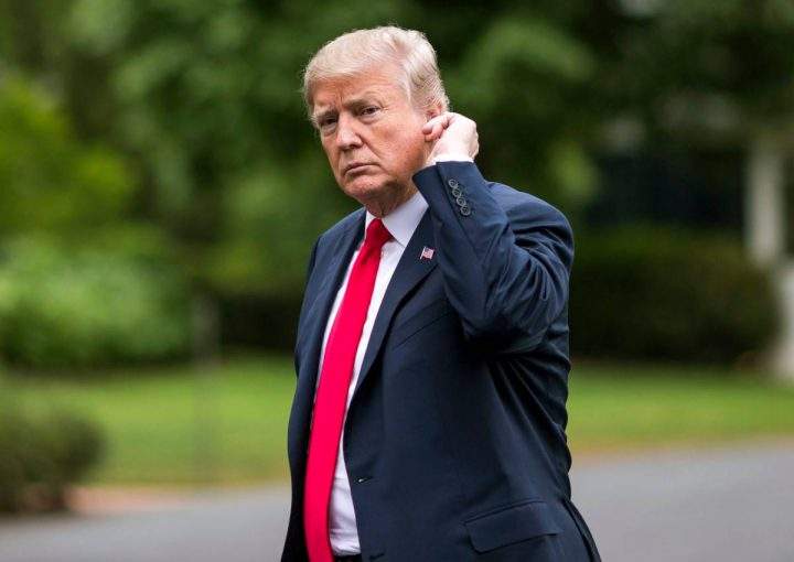 Donald Trump crosses the South Lawn after arriving at the White House.